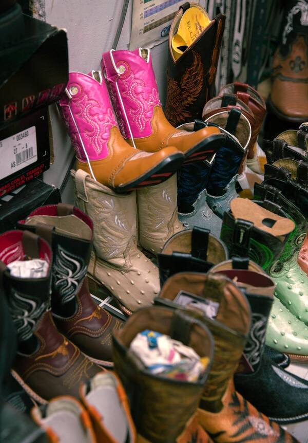 Photo by ArtCenter Photography student and former Las Fotos Project student Maria Evelyn Romero Gomez, of cowboy boots in a shop in her Boyle Heights neighborhood. Photo courtesy of Gomez.