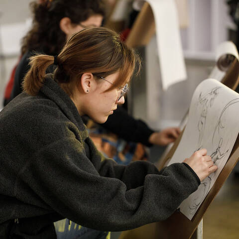 ArtCenter student in a figure drawing class