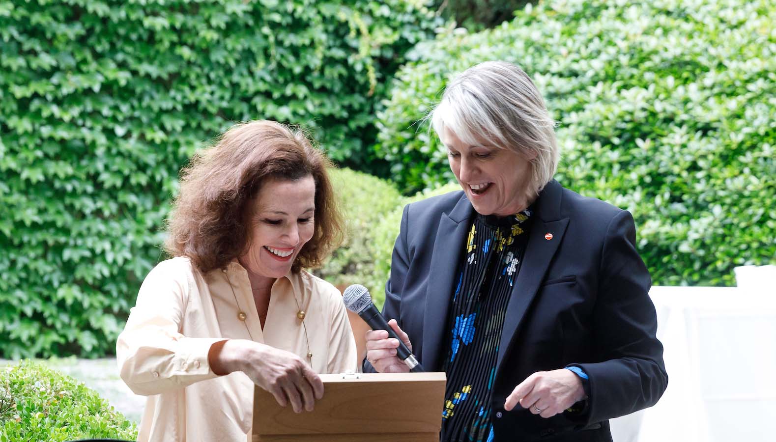 ArtCenter President Karen Hofmann (left) presented an honorary ArtCenter donor pencil to Pasadena Art Alliance President Annaly Bennett in recognition of a $1 million giving milestone. 