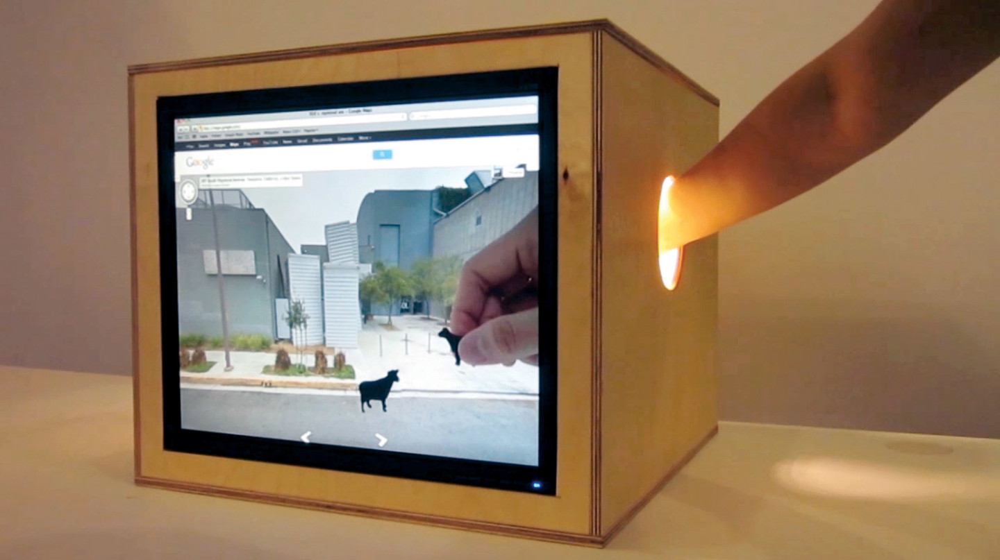 When+users+reach+into+their+%22portals%2C%22+their+hands+appear+to+meet+in+google+street+view+where+they+can+place+objects%2C+hold+events+and+meet.+This+real-time+hybrid+play+space+is+built+for+today%27s+network+culture.%0A%0AVidheecharoen+is+Senior+Interactive+Media+Designer+at+Scoot+%26+Doodle.%0A