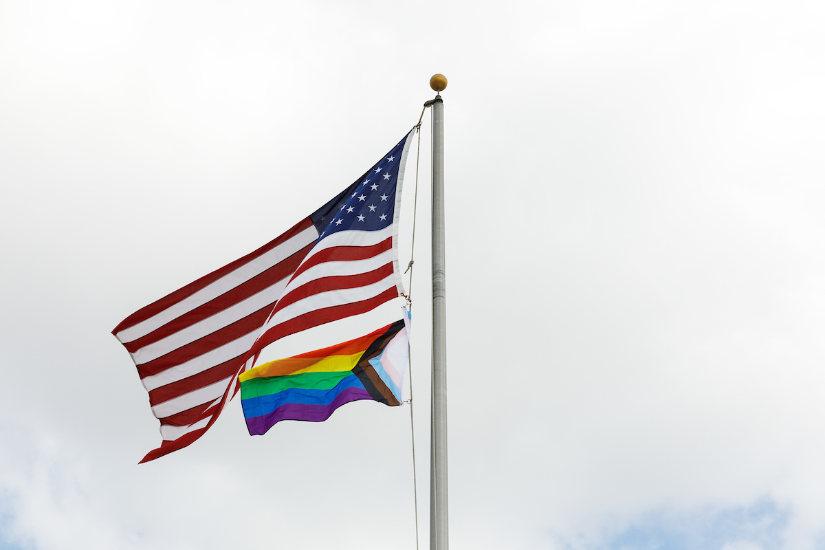 US flag and Progress Pride Flag