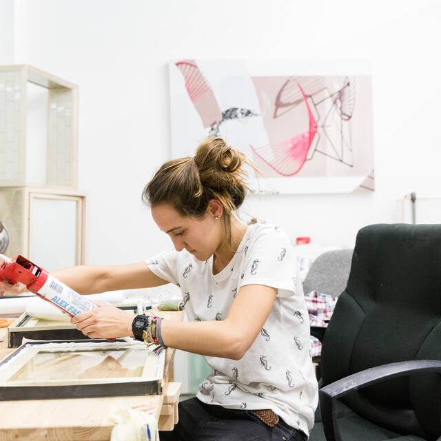 A student reviews photo film on a lightbox