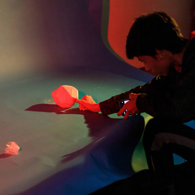 Photography student working on a lighting project