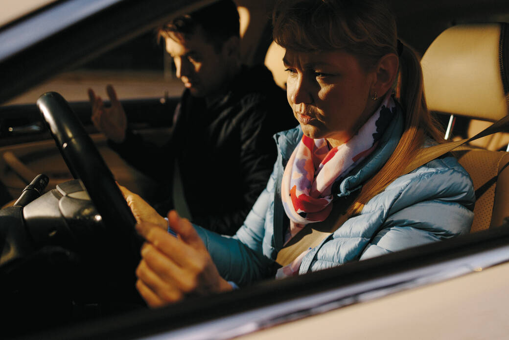 Nataliya Zhuk in West L.A., with her adult son teaching her to drive. Photo by Stella Kalinina for The Guardian.