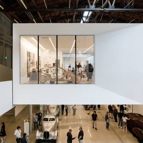 Interior of the Mullin Transportation Design Center at ArtCenter College of Design, showcasing its repurposed wind tunnel space with innovative design features supporting transportation design education.