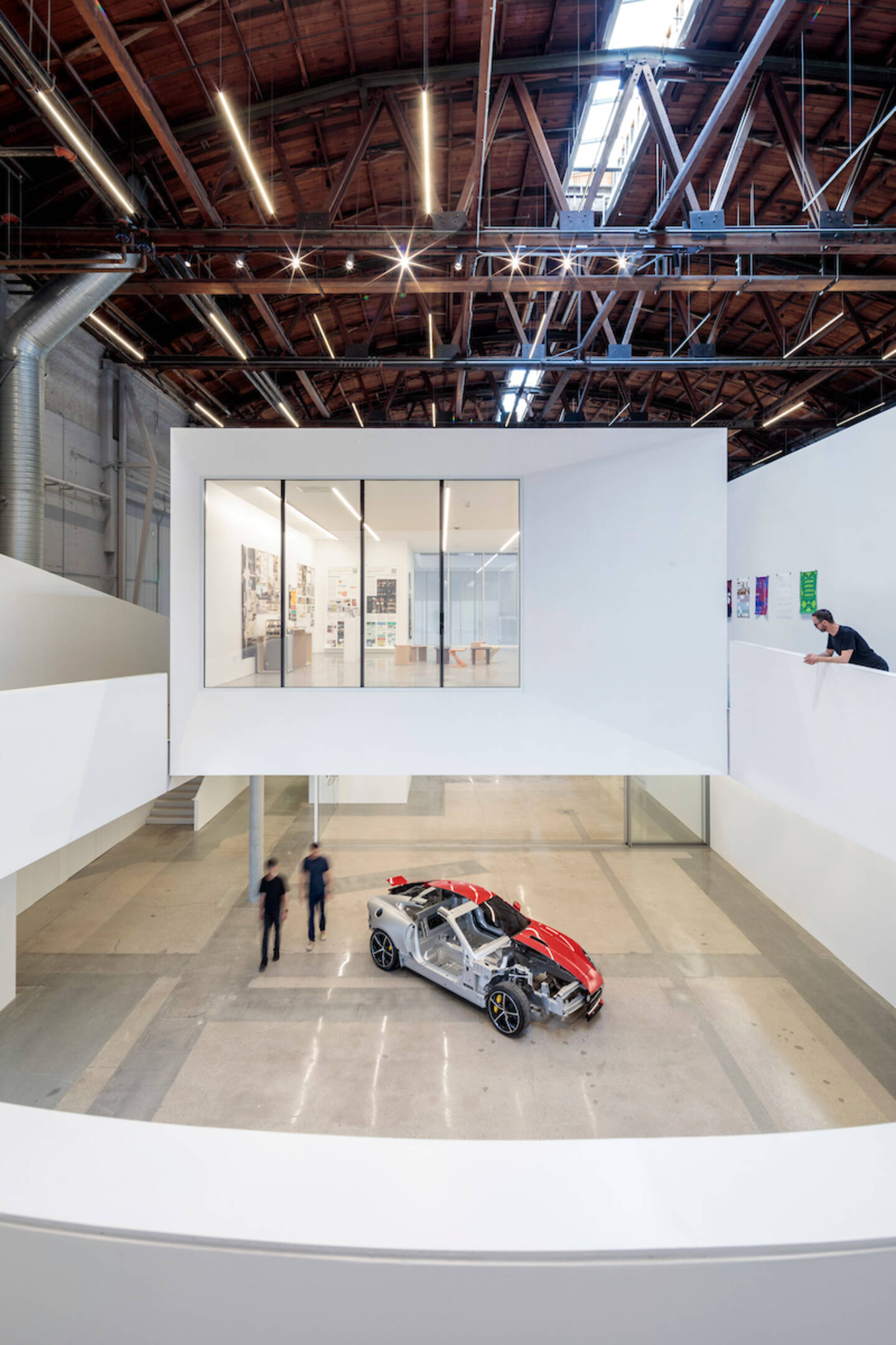 New+gallery+and+exhibition+space+and+a+hovering+mezzanine+provide+opportunities+for+greater+public+exposure+to+the+evolution+of+large-scale+designs+as+they+take+shape.+Photo+by+Joshua+White.+Design+by+Darin+Johnstone+Architects.