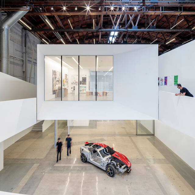 New+gallery+and+exhibition+space+and+a+hovering+mezzanine+provide+opportunities+for+greater+public+exposure+to+the+evolution+of+large-scale+designs+as+they+take+shape.+Photo+by+Joshua+White.+Design+by+Darin+Johnstone+Architects.