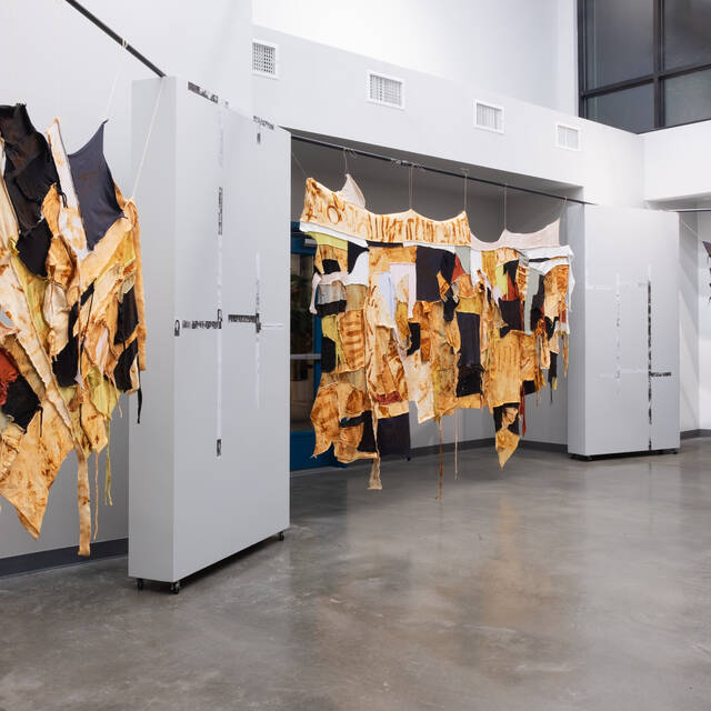 Jinseok+Choi%2C+%3Cem%3EBefore+the+Last+Spike+%28Installation+view%29+2023%3C%2Fem%3E%2C+Fabric+scraps+imprinted+with+railway+spikes+with+cyanotype+chemicals