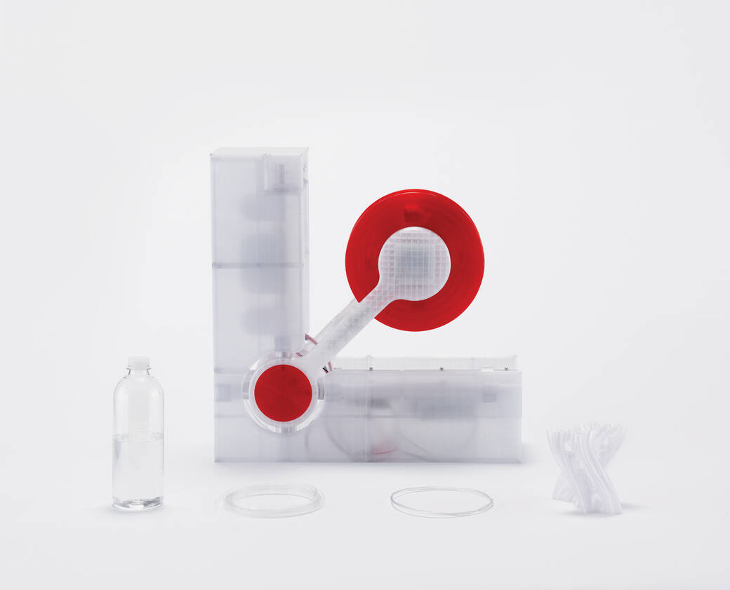 Polyformer, a 3D-printed, open-source machine, created by Reiten Cheng, that recycles clear PET plastic bottles into filaments for 3D printers.