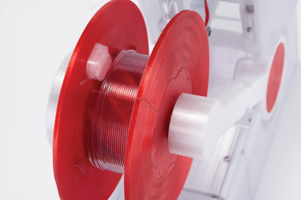 The spool of 3D-printed, open source machine Polyformer. 