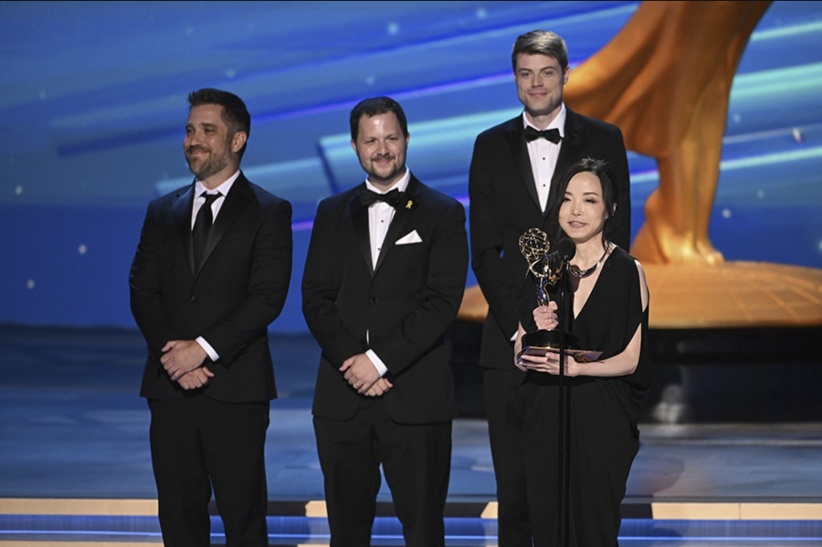 Nadia Tzuo accepting an award at the Emmys