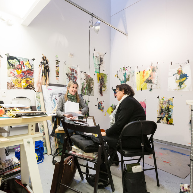 A Grad Art Student meets with a faculty memeber in her studio