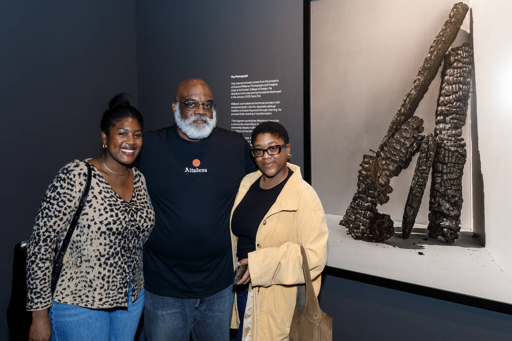 Alum and Photography and Imaging Chair Everard Williams with his daughters, next to his piece The Photograph, part of the installation Resilience in the Ashes at ArtCenter