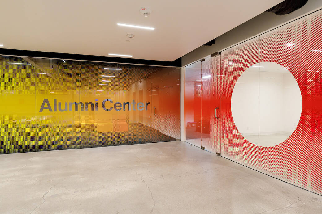 alumni lounge at ArtCenter featuring orange couches and a view of the san gabriel mountains