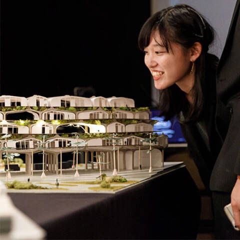 /High school student building a scale model in Interior Design class at ArtCenter Summer Extension, designing immersive spaces.