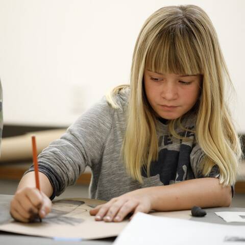 /High school students sketching in Creature Design class at ArtCenter Summer Extension, working on an animal sketch.