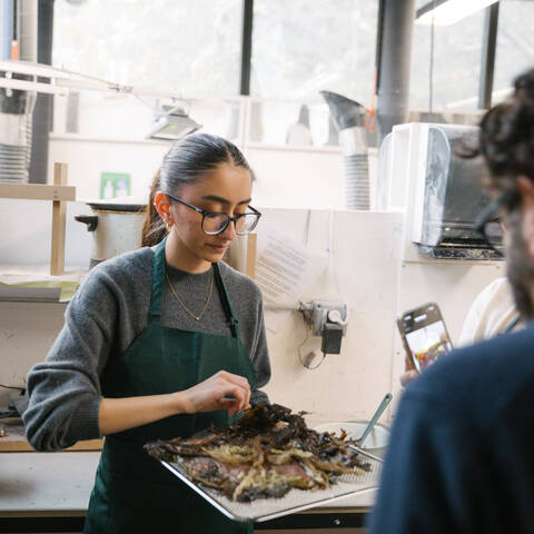 /Student exploring seaweed material