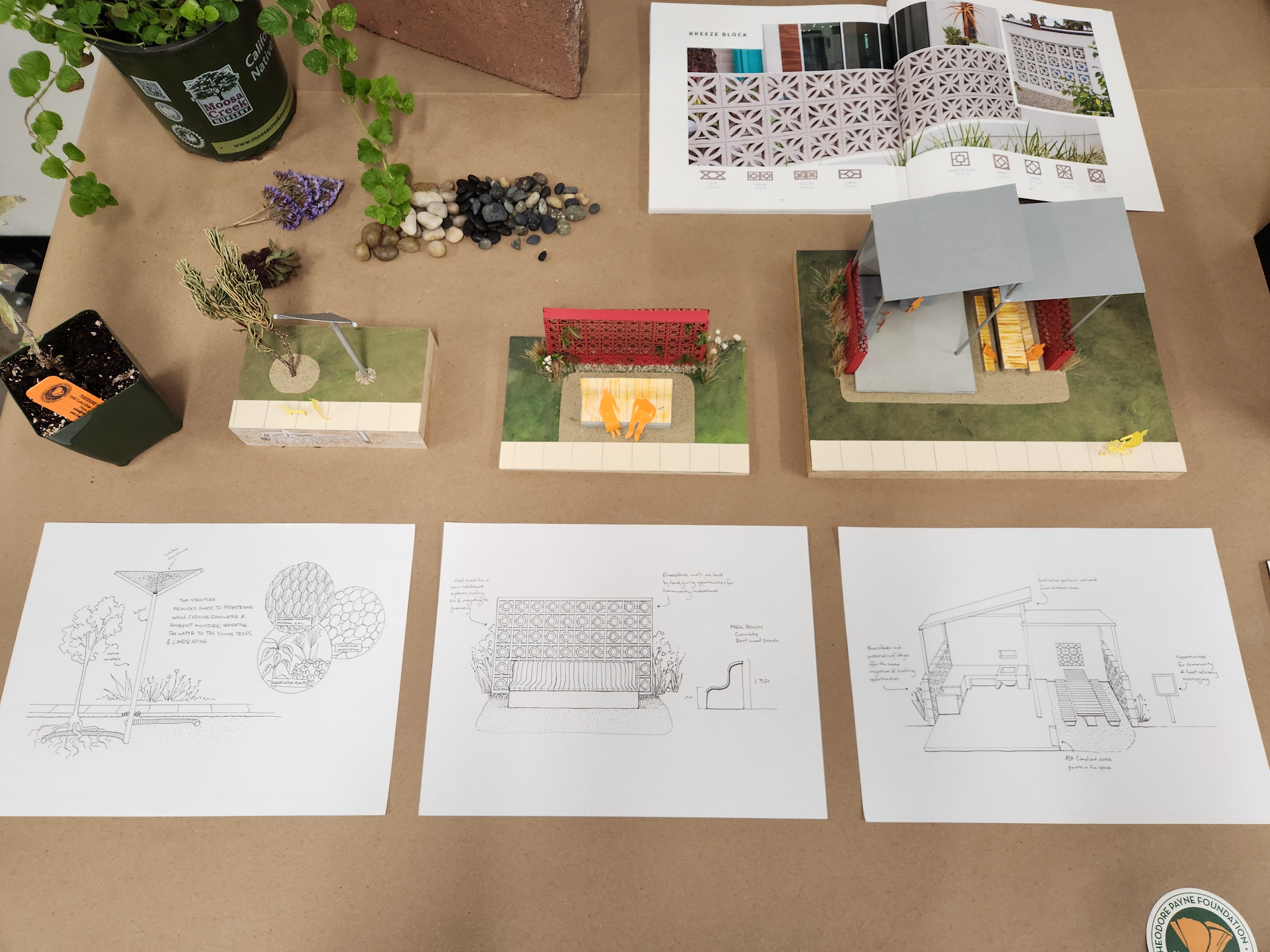 A table top displays three projects by Jasmine Dixon, all part of her Watts Life Outside concept