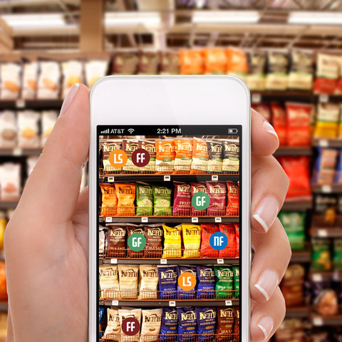 hand holding iphone in supermarket