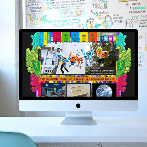 /photo of an iMac computer on a desk next to a potted cactus