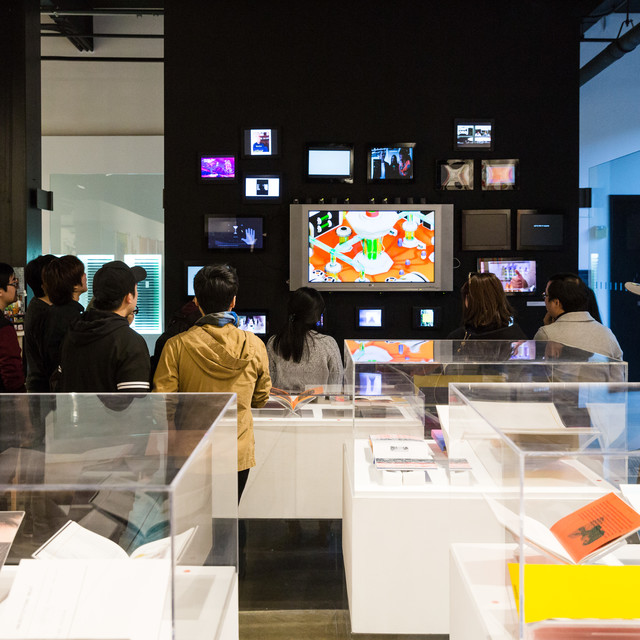 people viewing student artwork in the student gallery