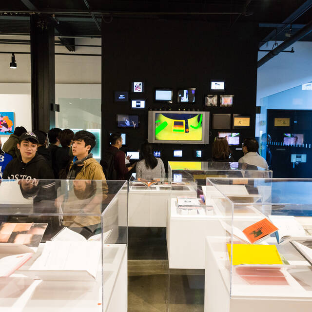 prospective students enjoying artwork in the ArtCenter student gallery