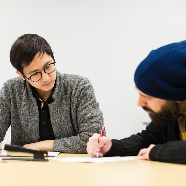 instructor and student reviewing the student