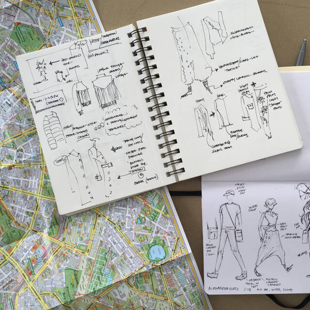 fashion sketches and a city map