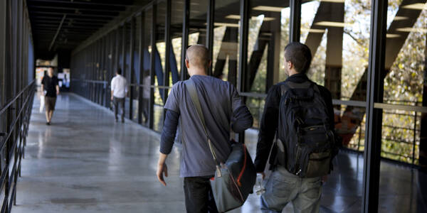 two men walking on bridge at Hillside Campus