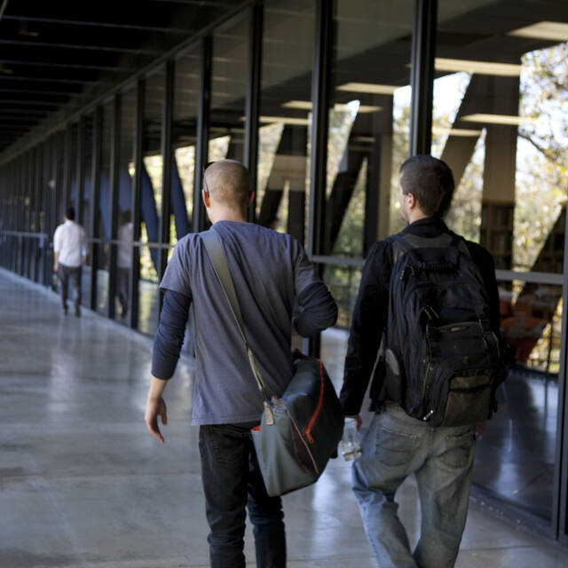 two men walking on bridge at Hillside Campus