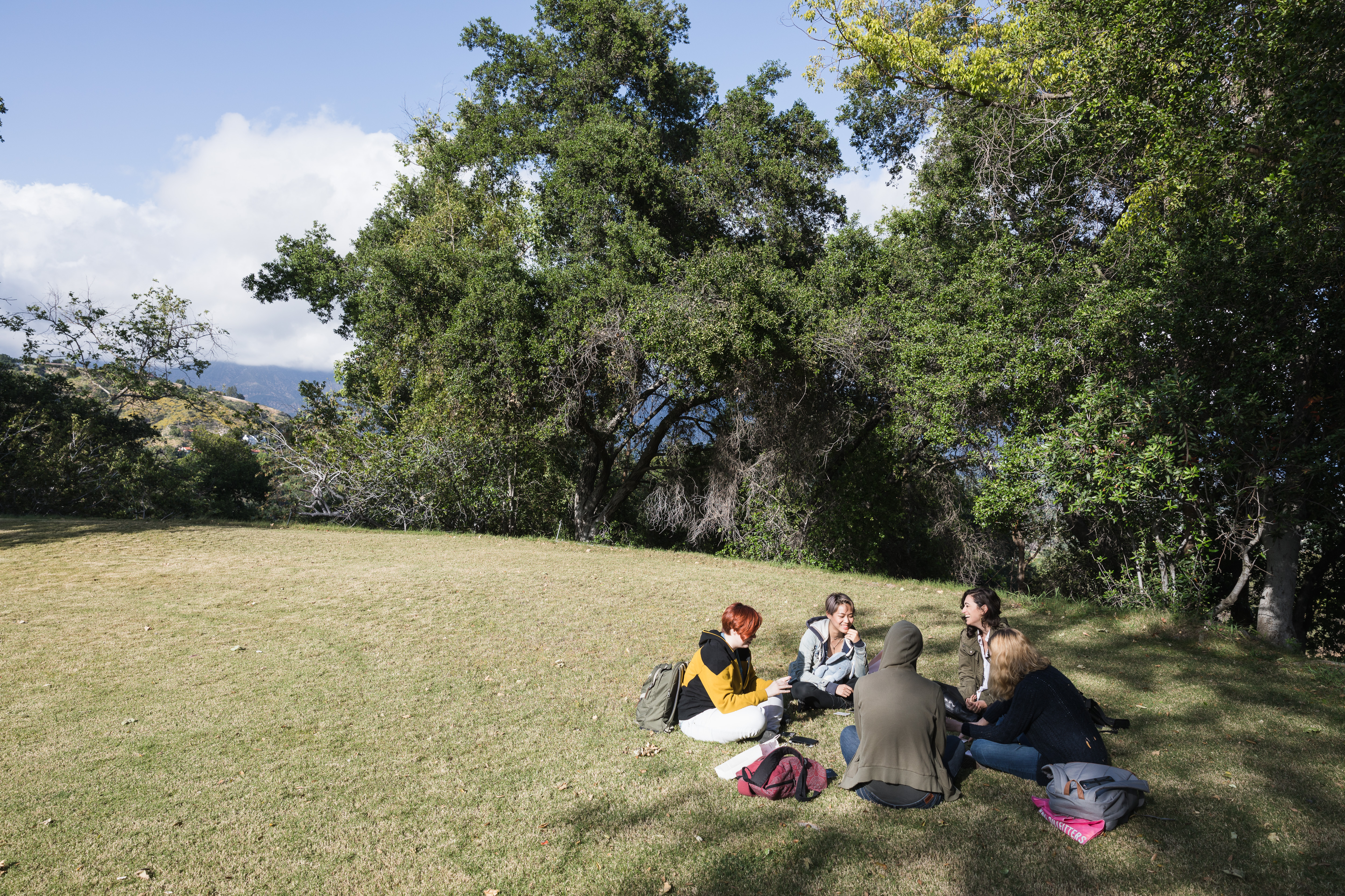 Students sitting on lawn at ArtCenter College of Design