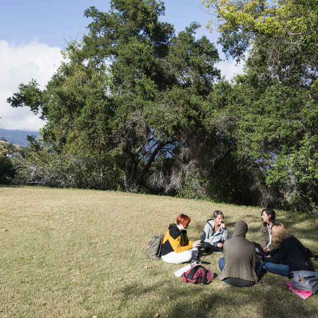 students sitting on lawn at Hillside Campus