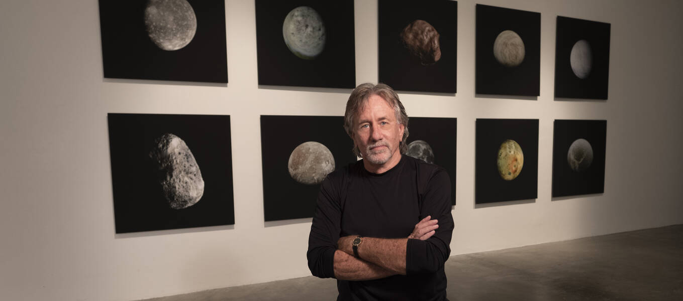 Stephen Nowlin in front of Moons exhibition