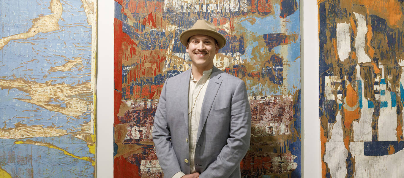 Detail of a photo of Graduate Art alum Edgar Ramirez in front of his work with Chris Sharp Gallery in the 2023 art fair Frieze Los Angeles’s Focus section for younger galleries. Photo by Juan Posada.