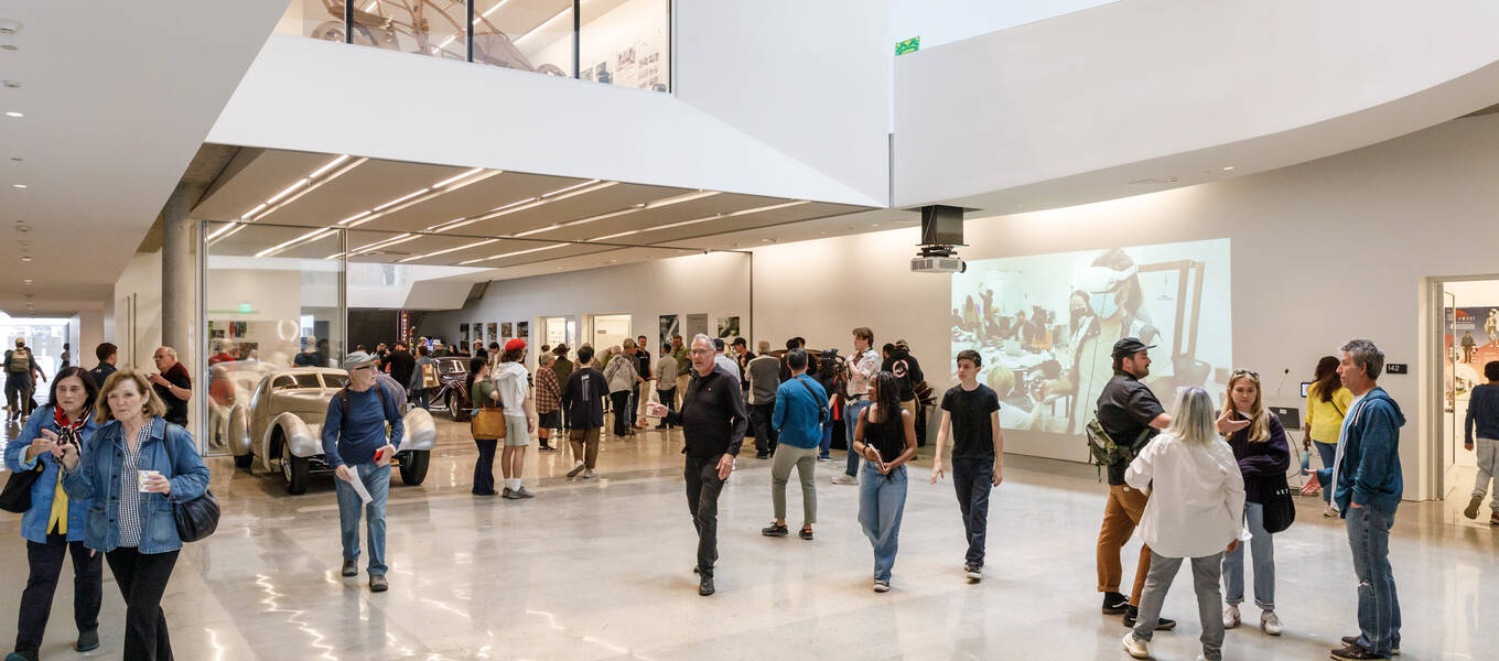 Visitors walk through the Mullin Transportation Design Center at 